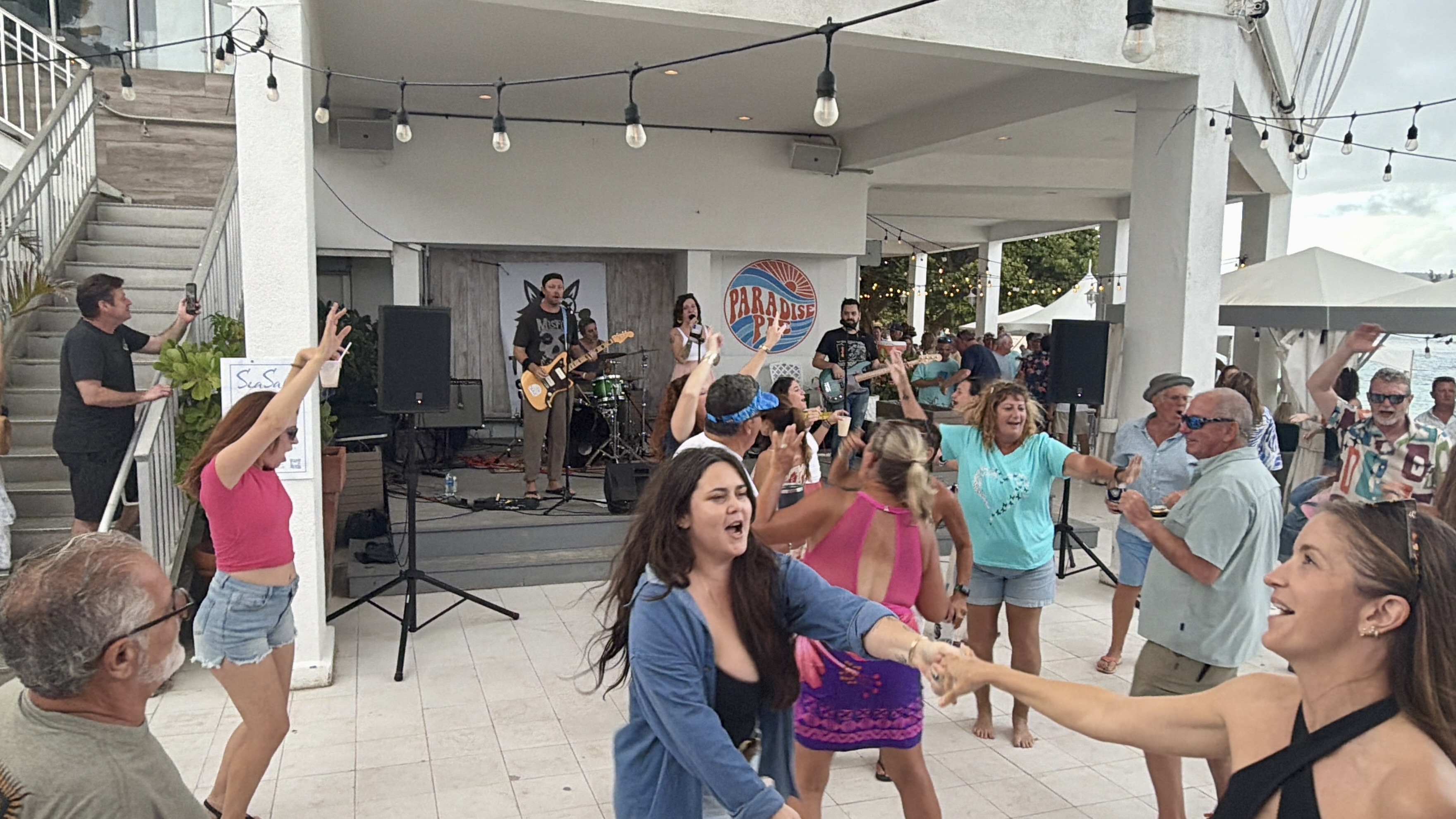 Packed crowd singing and dancing to The Heat Seekers at Sapphire Beach Bar St Thomas USVI