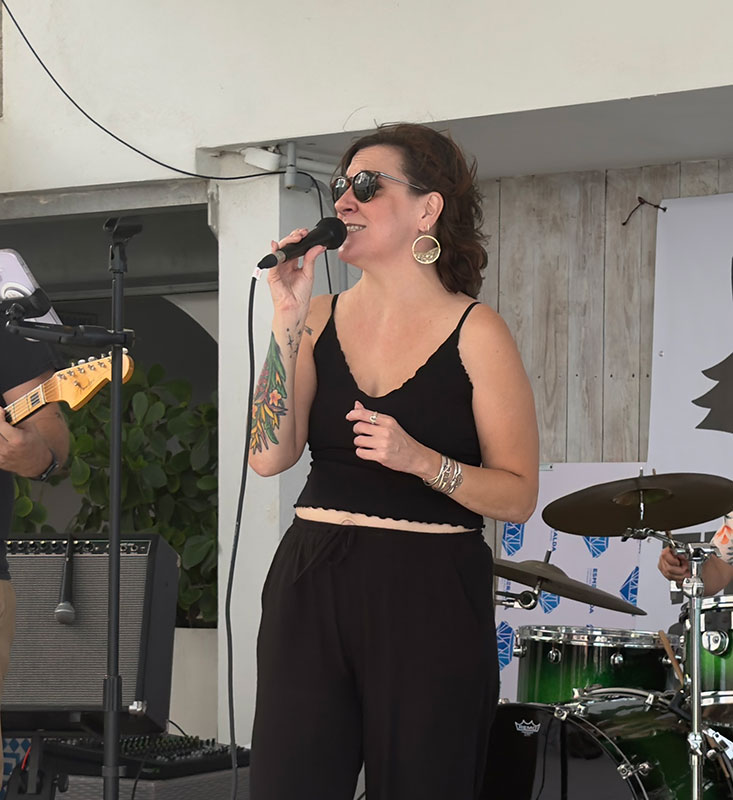 Heat Seekers lead vocalist Stef singing at Sapphire Beach Bar St Thomas
