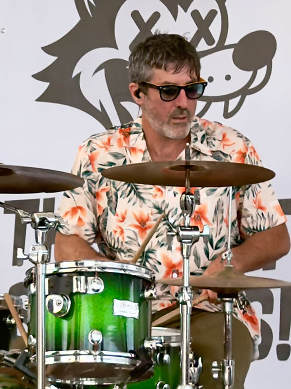 Heat Seekers drummer Tim playing at Sapphire Beach Bar with band banner St Thomas USVI